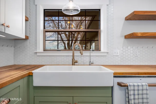 a bathroom with a sink and a window