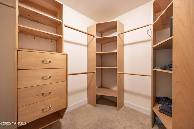 a bathroom with a shower curtain and a window