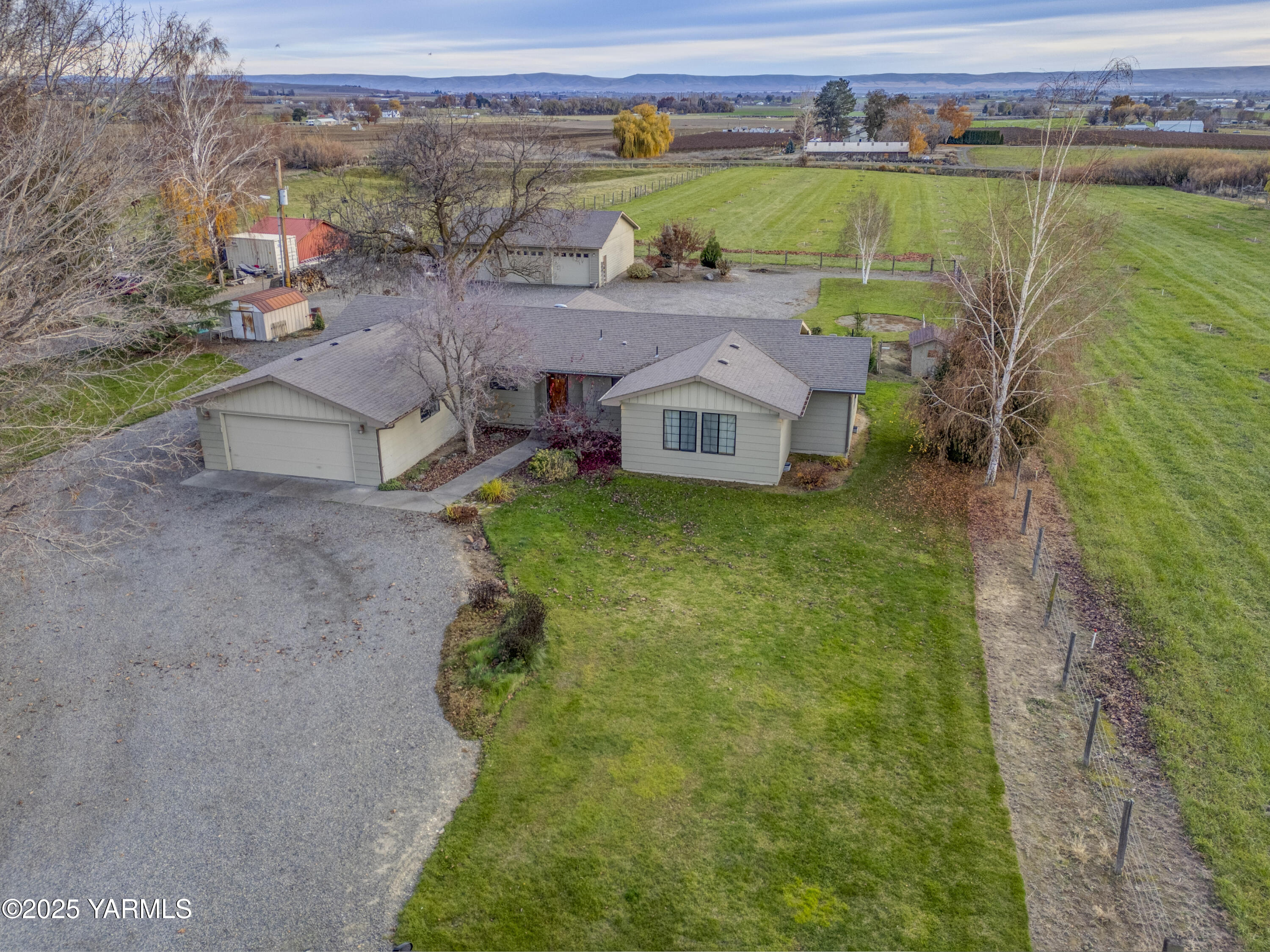 10240 Van Belle Road Sunnyside, WA 98944 - Photo 36 of 52 an aerial view of a house with a lake view
