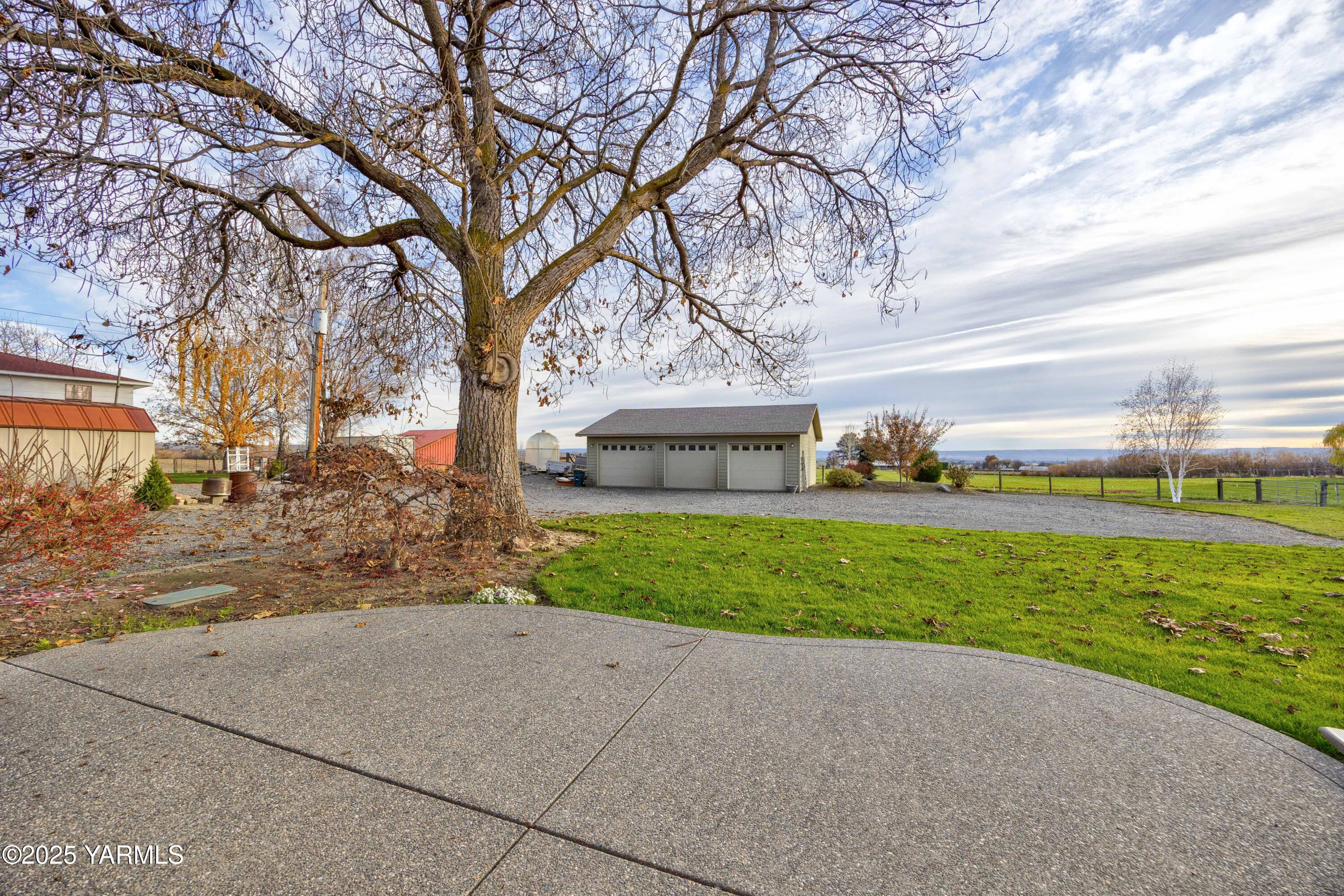 10240 Van Belle Road Sunnyside, WA 98944 - Photo 41 of 52 a front view of a house with a yard and garage