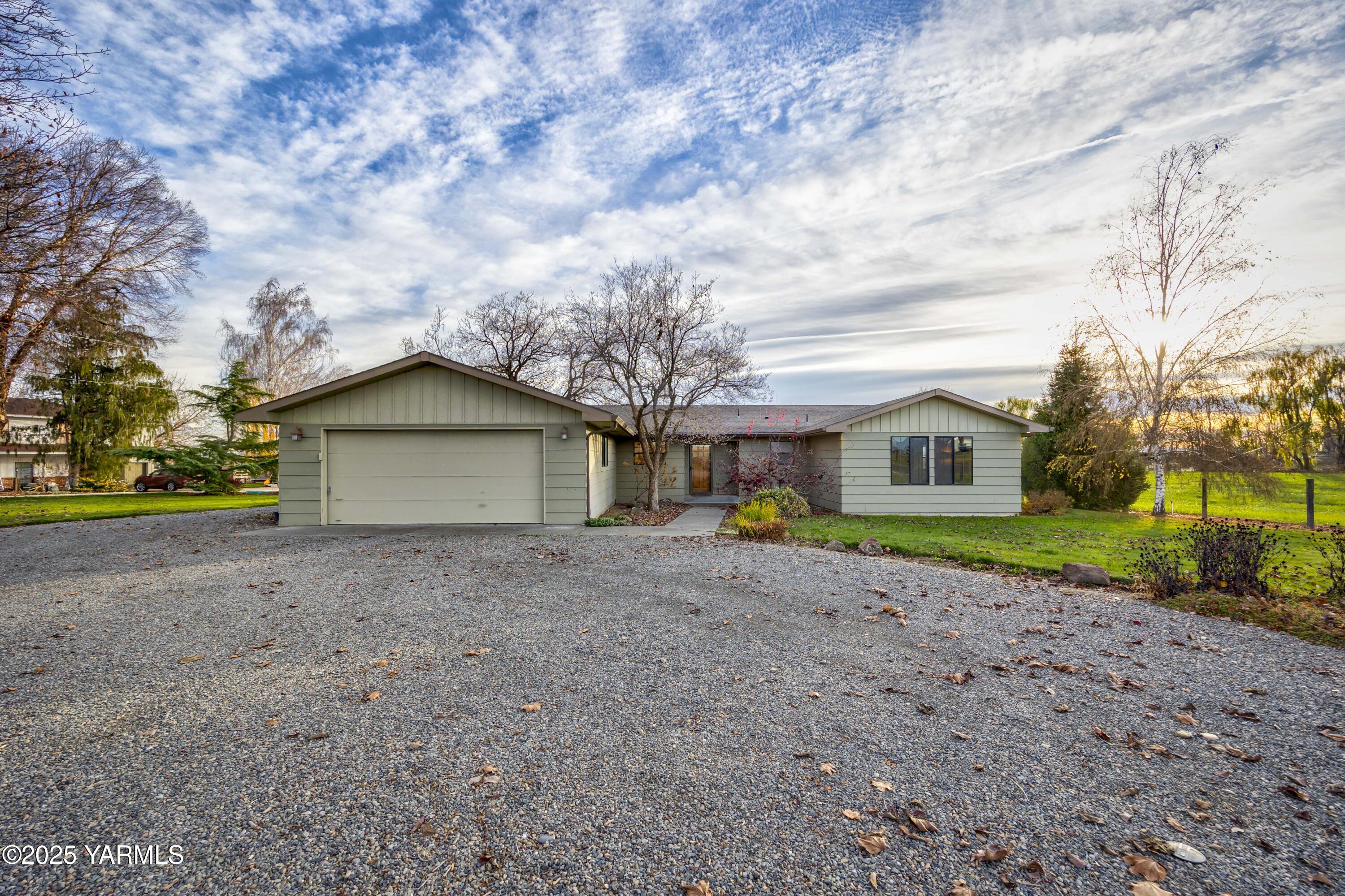 10240 Van Belle Road Sunnyside, WA 98944 - Photo 43 of 52 a view of a house with a yard and large tree