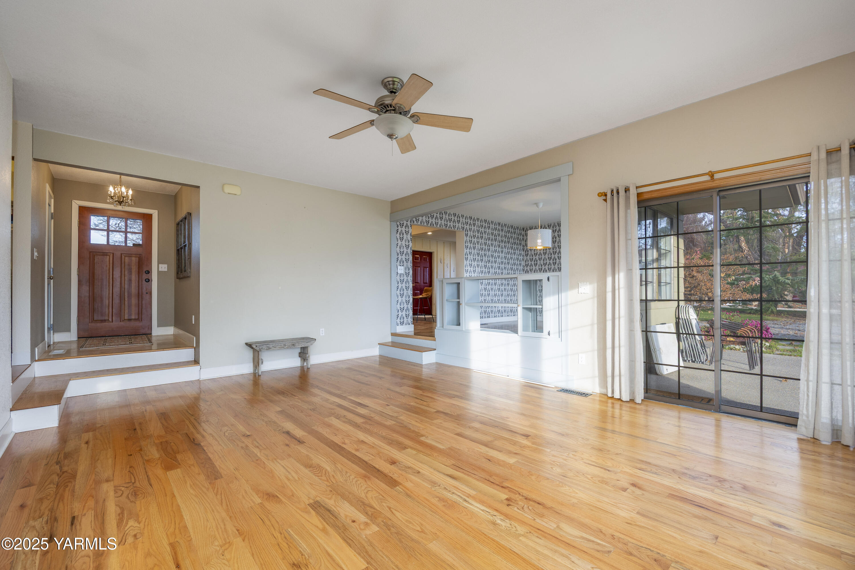 10240 Van Belle Road Sunnyside, WA 98944 - Photo 8 of 52 a view of empty room with wooden floor and fan
