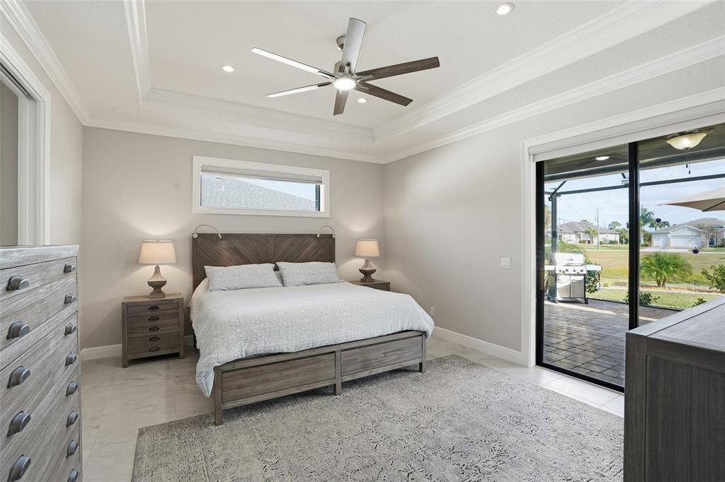 7416 South Seagrape Road Punta Gorda, FL 33955 - Photo 14 of 39 a bedroom with a bed and window