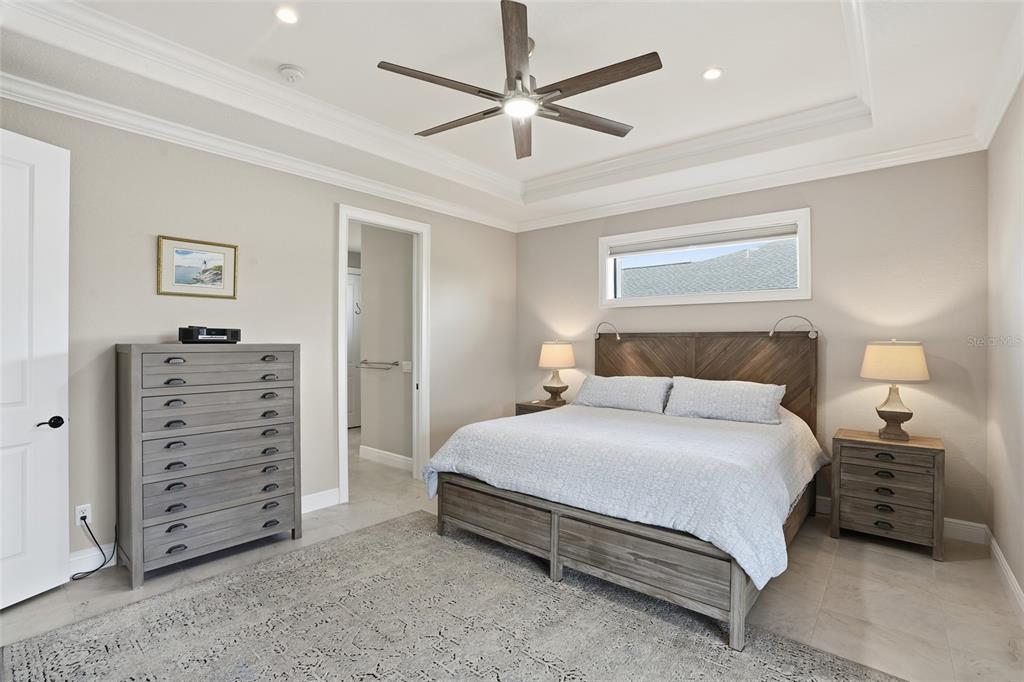 7416 South Seagrape Road Punta Gorda, FL 33955 - Photo 16 of 39 a bedroom with a bed and a walk in closet