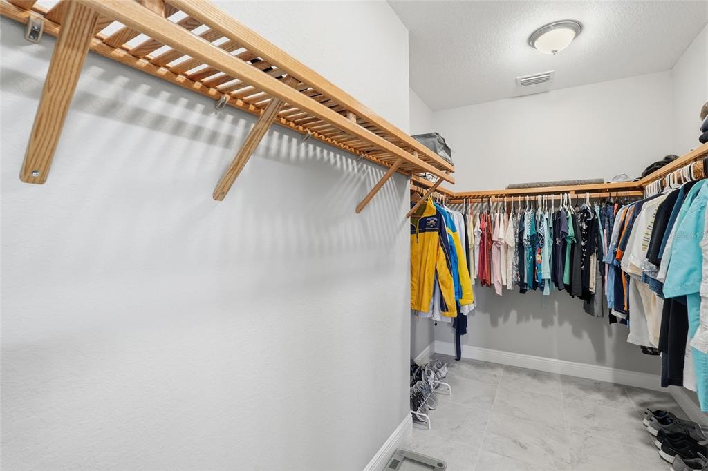 7416 South Seagrape Road Punta Gorda, FL 33955 - Photo 20 of 39 a view of walk in closet with clothes