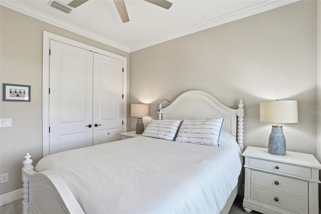 7416 South Seagrape Road Punta Gorda, FL 33955 - Photo 22 of 39 a bedroom with a bed and a night stand