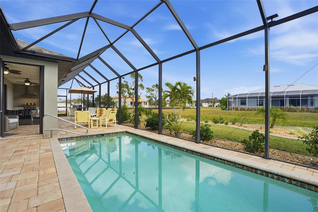 7416 South Seagrape Road Punta Gorda, FL 33955 - Photo 35 of 39 a view of a swimming pool with a porch