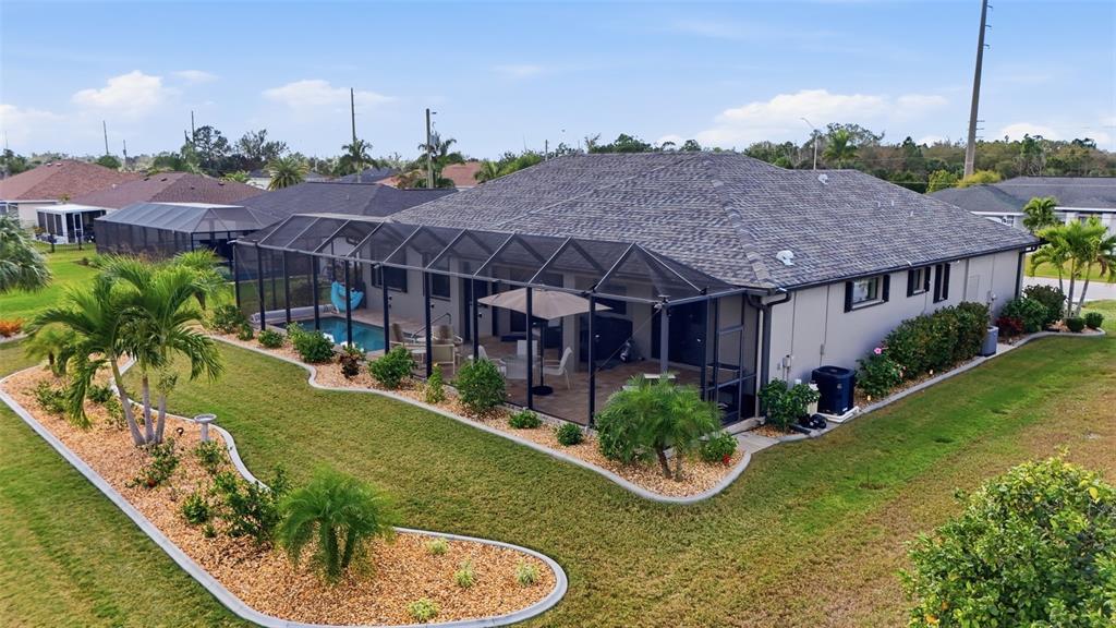 7416 South Seagrape Road Punta Gorda, FL 33955 - Photo 38 of 39 a aerial view of a house next to a big yard