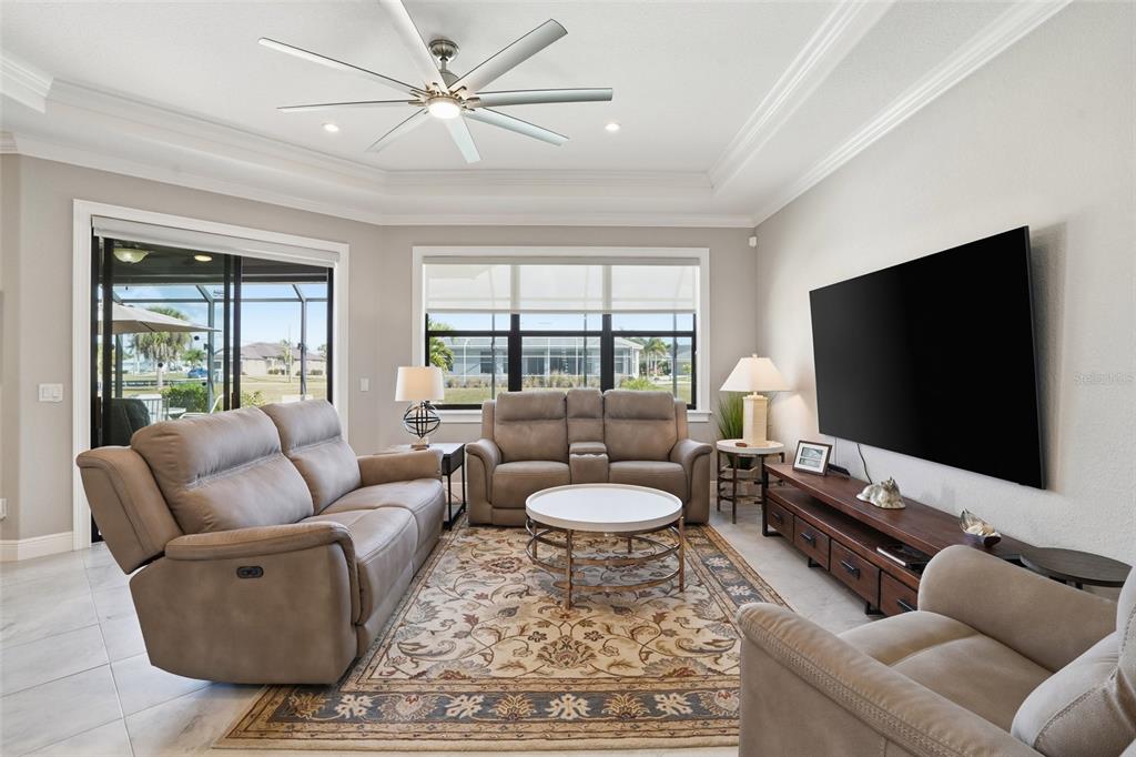 7416 South Seagrape Road Punta Gorda, FL 33955 - Photo 7 of 39 a living room with furniture and a flat screen tv