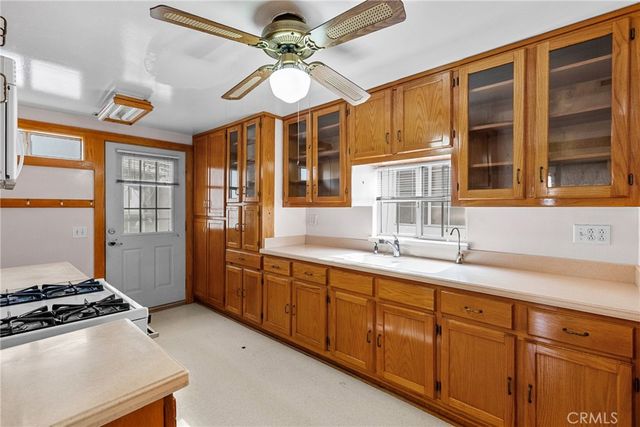 a kitchen with stainless steel appliances granite countertop a stove and a sink