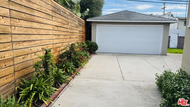 a view of garage with a potted plant