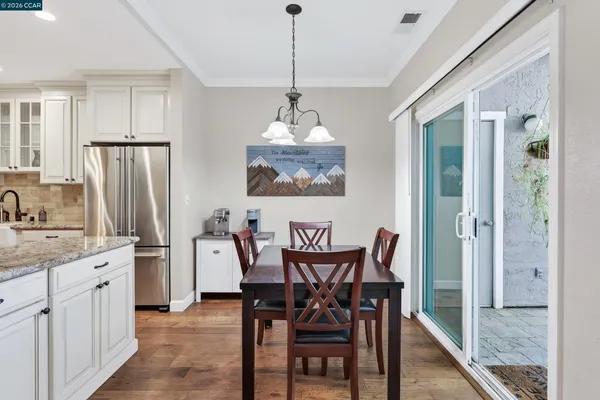 a dining room with furniture and window