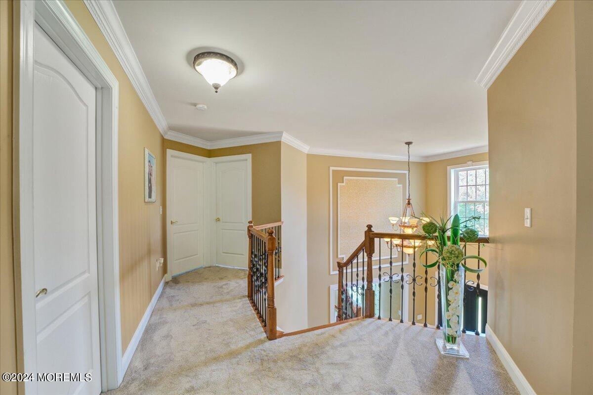 26 Emily Road Manalapan, NJ 07726 - Photo 20 of 49 a view of a hallway with interior of the house