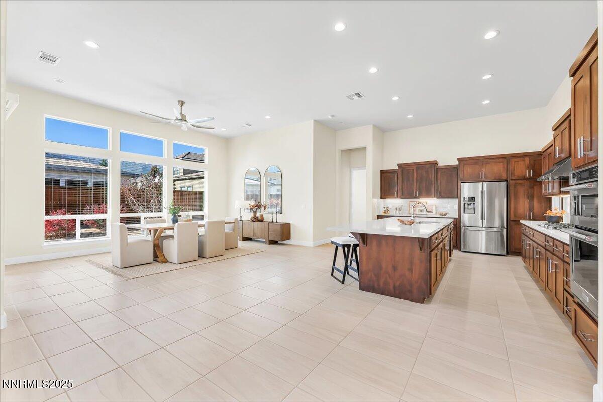 9040 Boomtown Garson Road Verdi, NV 89439 - Photo 11 of 35 a large living room with stainless steel appliances furniture a rug and a large window