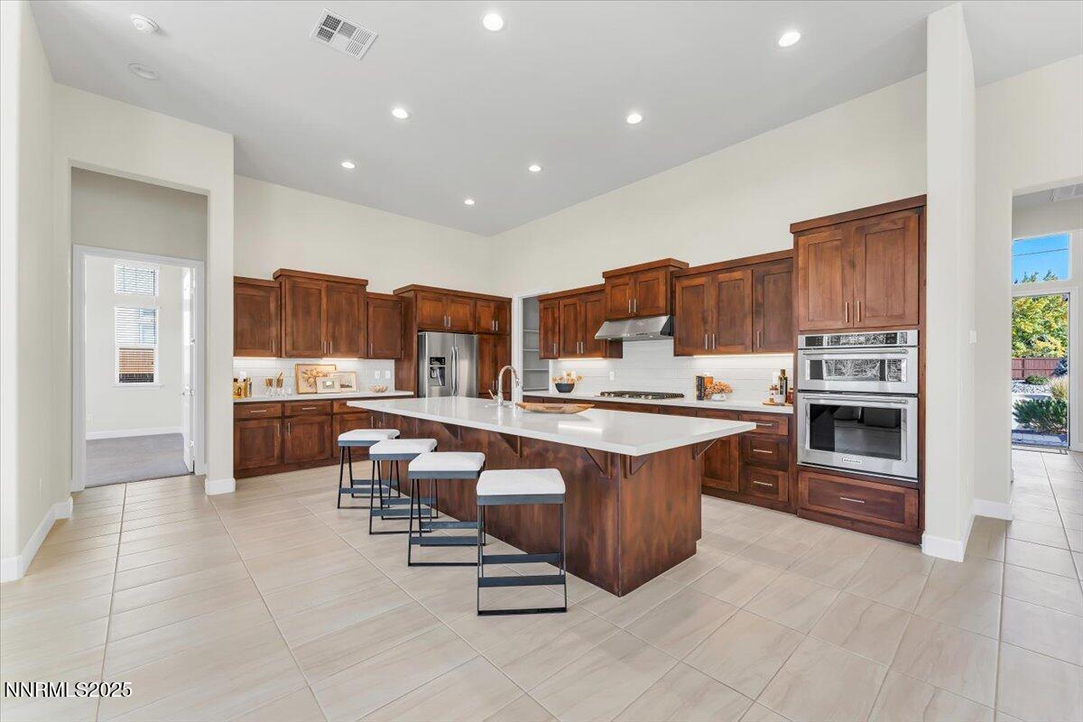 9040 Boomtown Garson Road Verdi, NV 89439 - Photo 13 of 35 a large kitchen with lots of counter and chairs