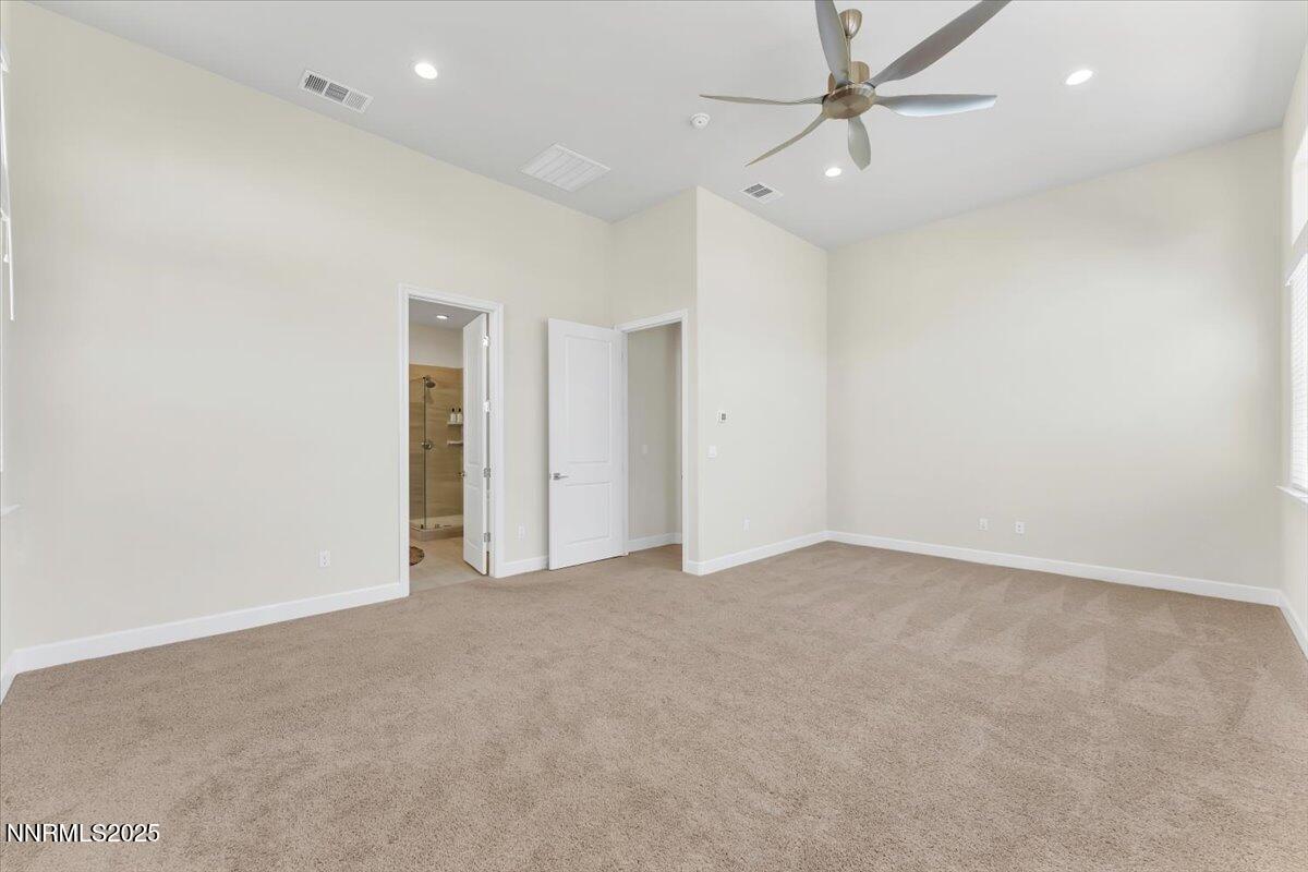 9040 Boomtown Garson Road Verdi, NV 89439 - Photo 19 of 35 an empty room with fan and a ceiling fan