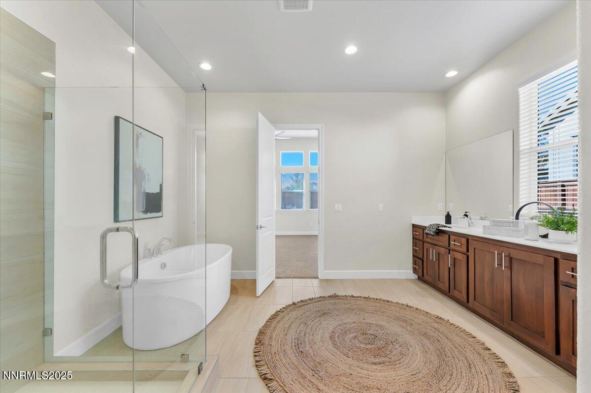9040 Boomtown Garson Road Verdi, NV 89439 - Photo 21 of 35 a spacious bathroom with a toilet sink and mirror