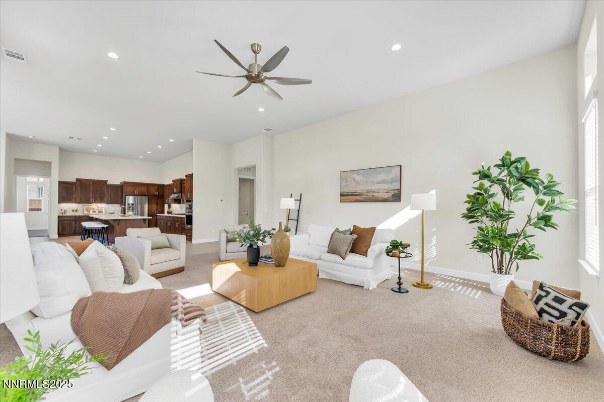 9040 Boomtown Garson Road Verdi, NV 89439 - Photo 9 of 35 a living room with furniture and a chandelier