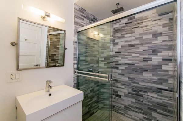 35 Winslow Road, Unit 1 Brookline, MA 02446 - Photo 3 of 10 a bathroom with a shower and a sink