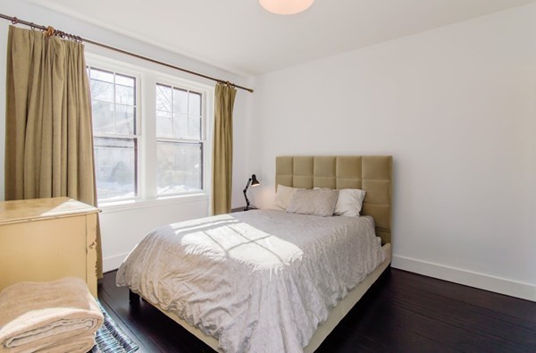 35 Winslow Road, Unit 1 Brookline, MA 02446 - Photo 6 of 10 a bedroom with a bed and a window