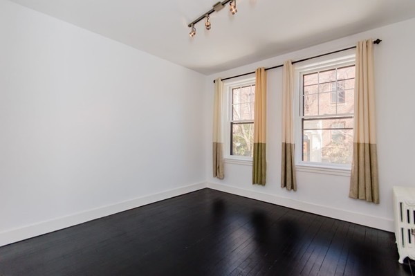 35 Winslow Road, Unit 1 Brookline, MA 02446 - Photo 8 of 10 a view of wooden floor and windows in a room