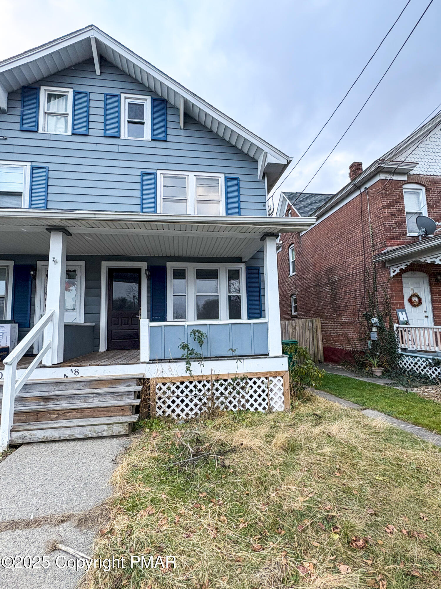 418 North Courtland Street, Unit 418 East Stroudsburg, PA 18301 - Photo 1 of 18 a front view of a house with a garden