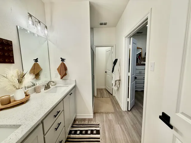 a bathroom with a toilet and a mirror
