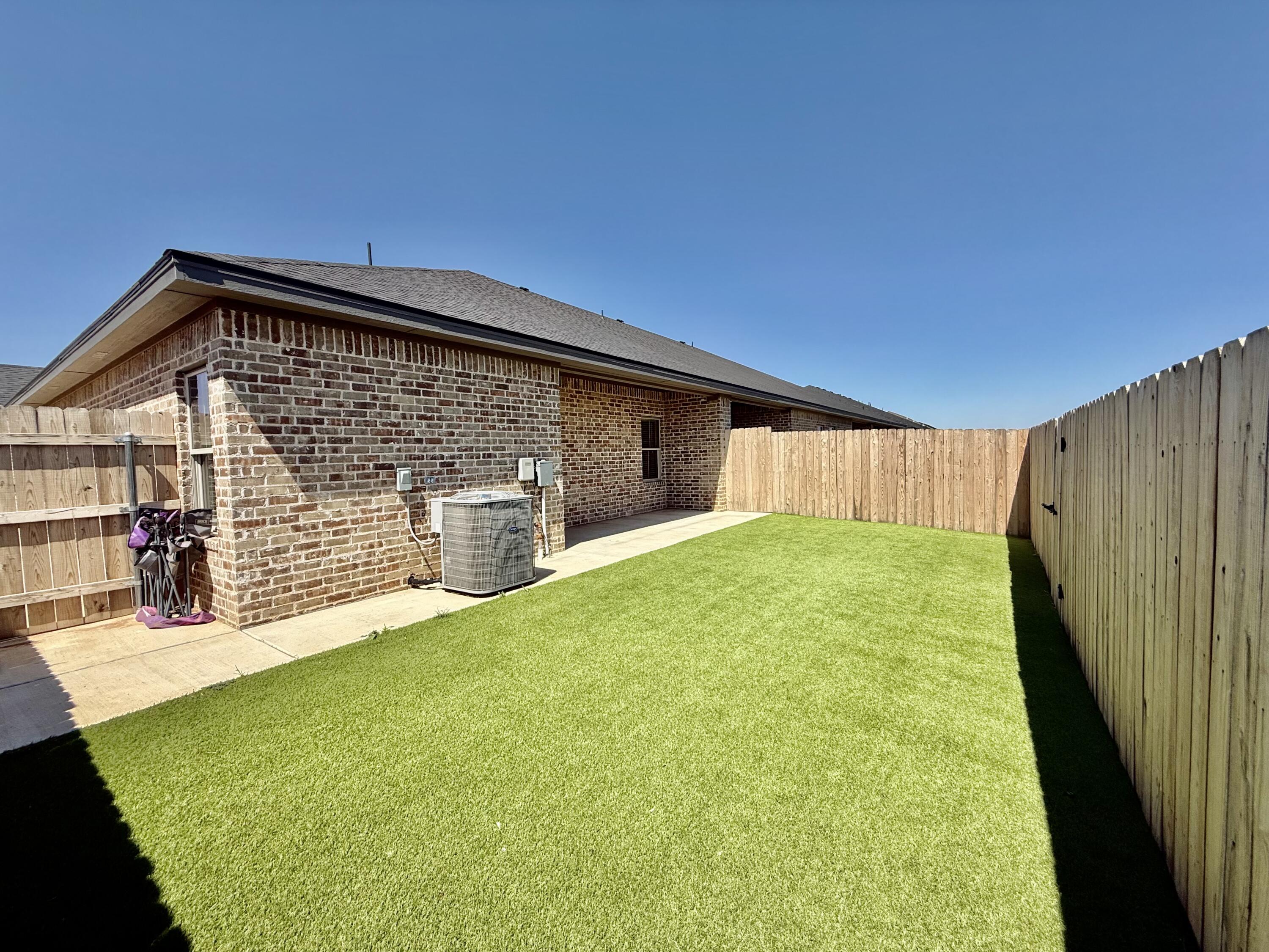 5825 Virginia Avenue Lubbock, TX 79407 - Photo 17 of 29 a view of a house with a backyard