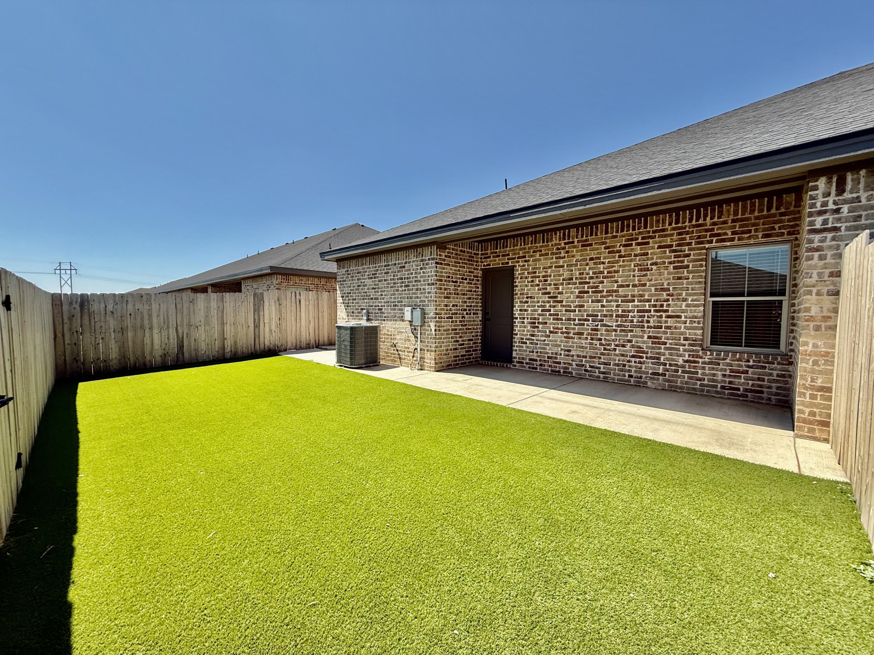 5825 Virginia Avenue Lubbock, TX 79407 - Photo 18 of 29 a view of a backyard with a small cabin