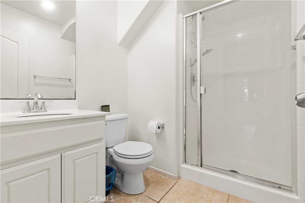 8541 Oak Barrel Place, Unit 2 Rancho Cucamonga, CA 91730 - Photo 11 of 50 a bathroom with a toilet sink and shower
