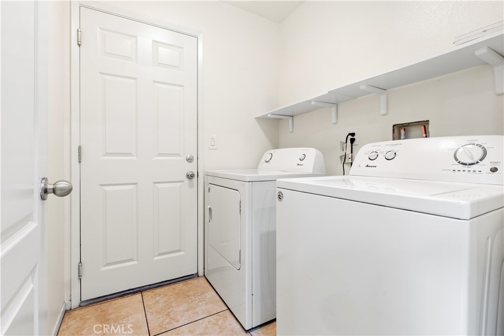 8541 Oak Barrel Place, Unit 2 Rancho Cucamonga, CA 91730 - Photo 12 of 50 a utility room with dryer and washer