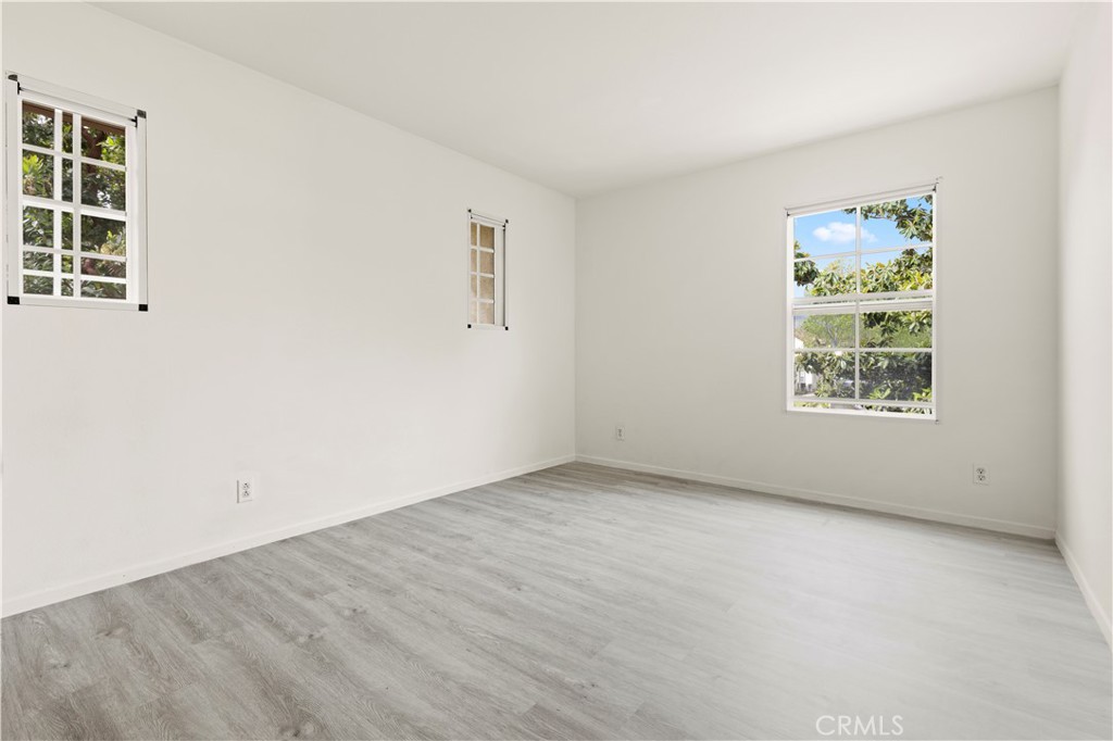 8541 Oak Barrel Place, Unit 2 Rancho Cucamonga, CA 91730 - Photo 15 of 50 an empty room with windows