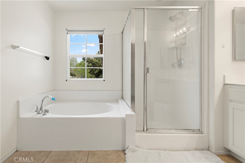8541 Oak Barrel Place, Unit 2 Rancho Cucamonga, CA 91730 - Photo 19 of 50 a white bath tub sitting next to a shower