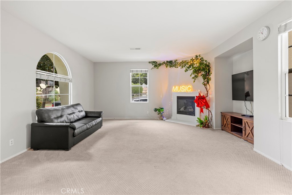 8541 Oak Barrel Place, Unit 2 Rancho Cucamonga, CA 91730 - Photo 2 of 50 a view of living room with furniture and a flat screen tv
