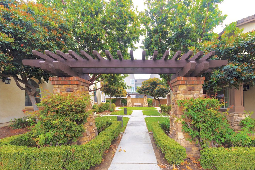 8541 Oak Barrel Place, Unit 2 Rancho Cucamonga, CA 91730 - Photo 25 of 50 a view of a pathway with a yard