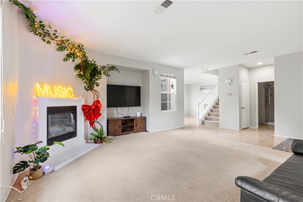 8541 Oak Barrel Place, Unit 2 Rancho Cucamonga, CA 91730 - Photo 3 of 50 a view of a livingroom with a flat screen tv