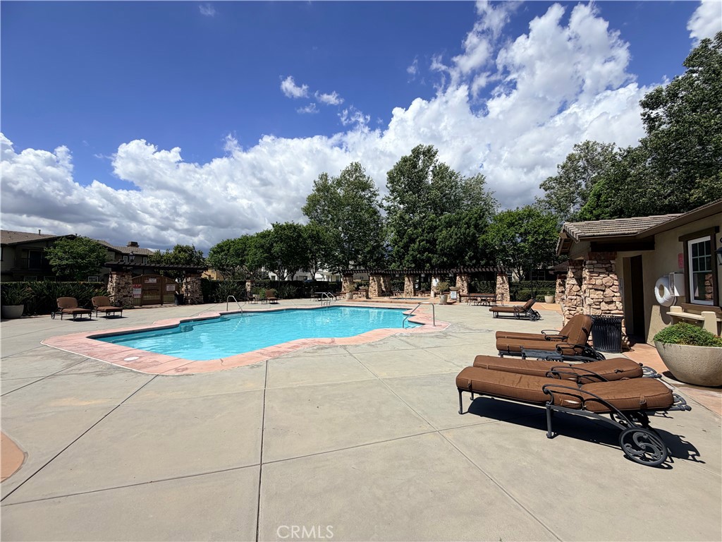 8541 Oak Barrel Place, Unit 2 Rancho Cucamonga, CA 91730 - Photo 33 of 50 a view of a patio with swimming pool and sitting area