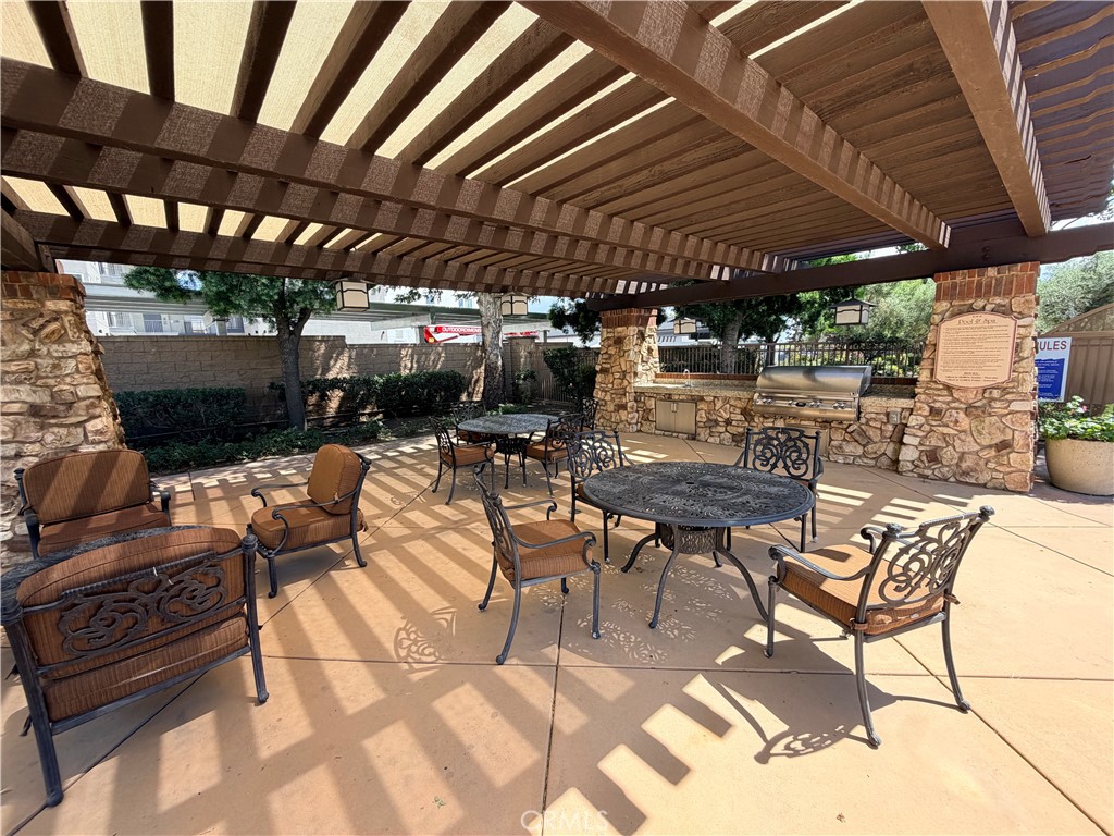 8541 Oak Barrel Place, Unit 2 Rancho Cucamonga, CA 91730 - Photo 34 of 50 a view of a backyard with sitting area
