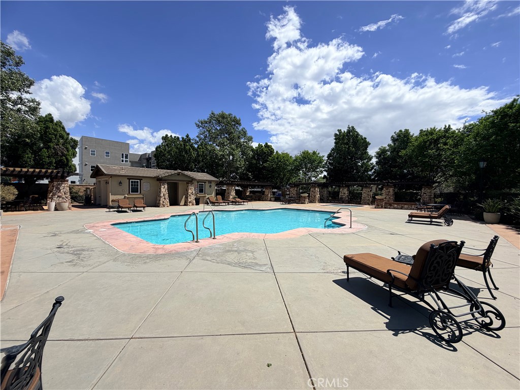 8541 Oak Barrel Place, Unit 2 Rancho Cucamonga, CA 91730 - Photo 36 of 50 a view of swimming pool with seating space and covered with trees