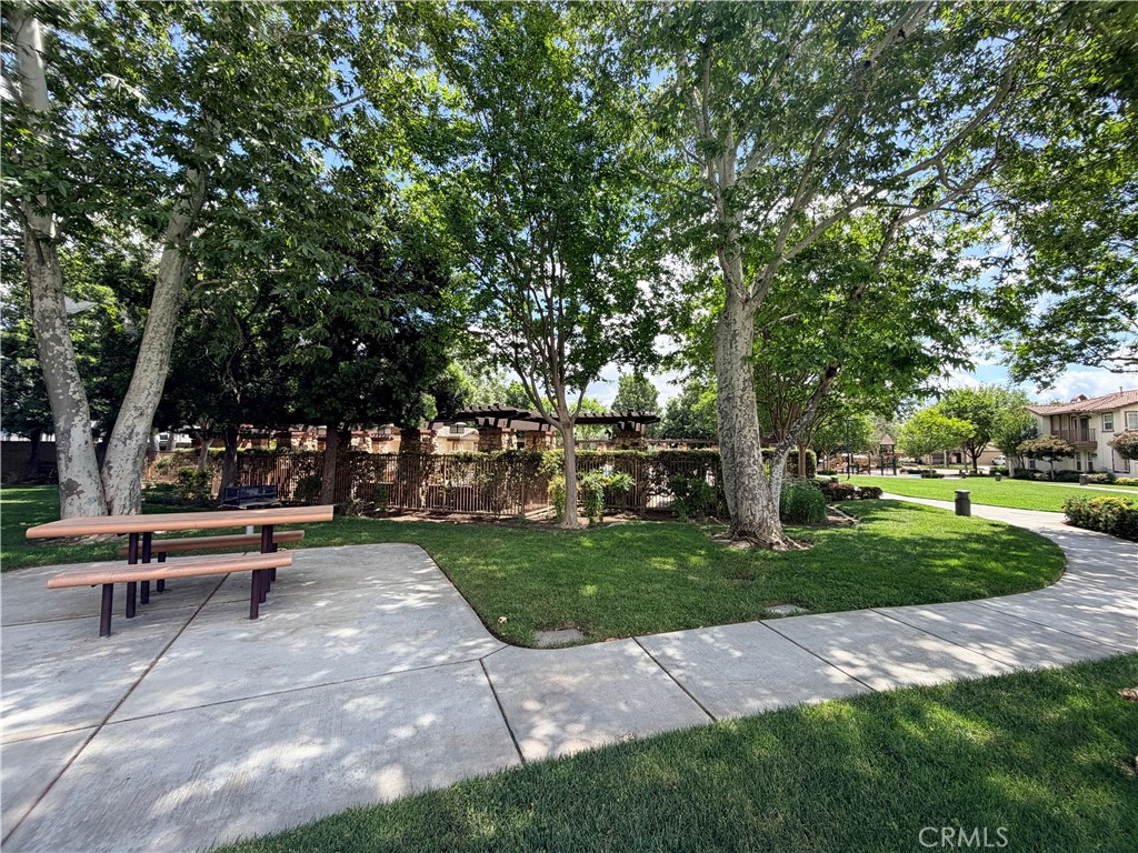 8541 Oak Barrel Place, Unit 2 Rancho Cucamonga, CA 91730 - Photo 39 of 50 a view of a park with trees and wooden fence