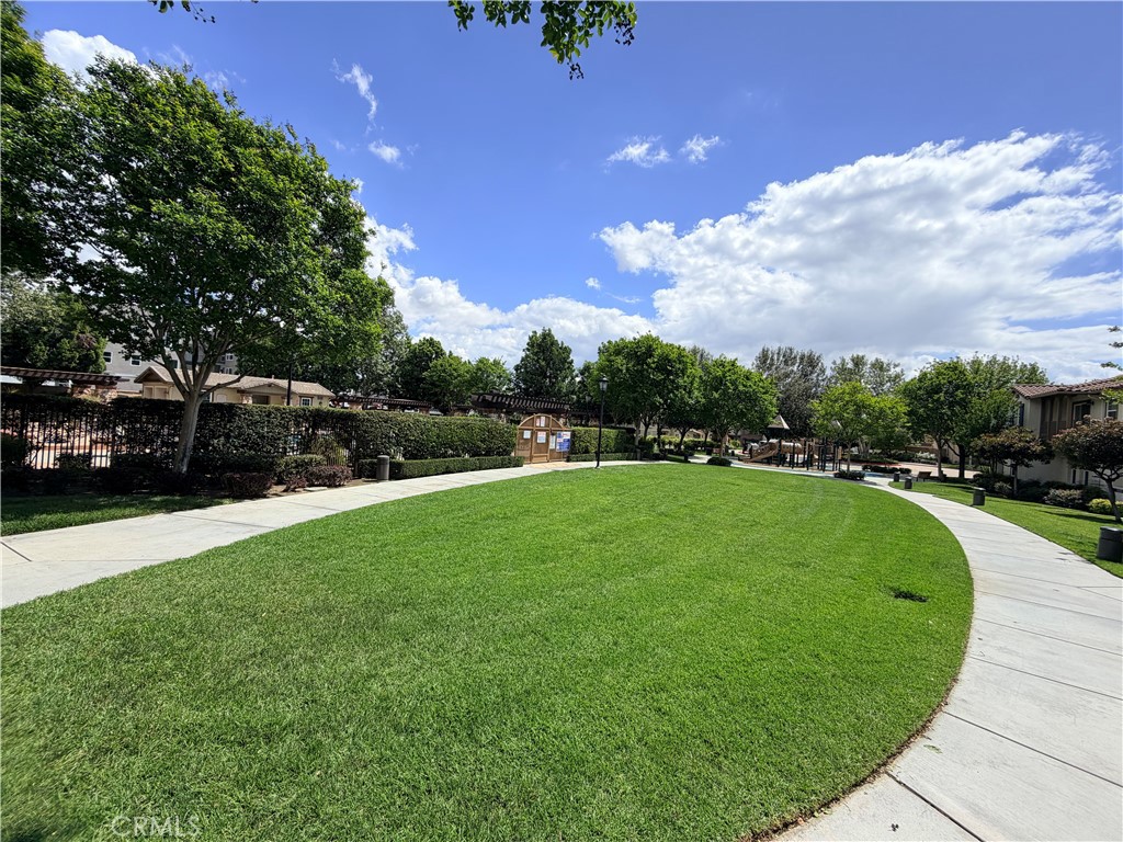 8541 Oak Barrel Place, Unit 2 Rancho Cucamonga, CA 91730 - Photo 40 of 50 a view of a garden and swimming pool