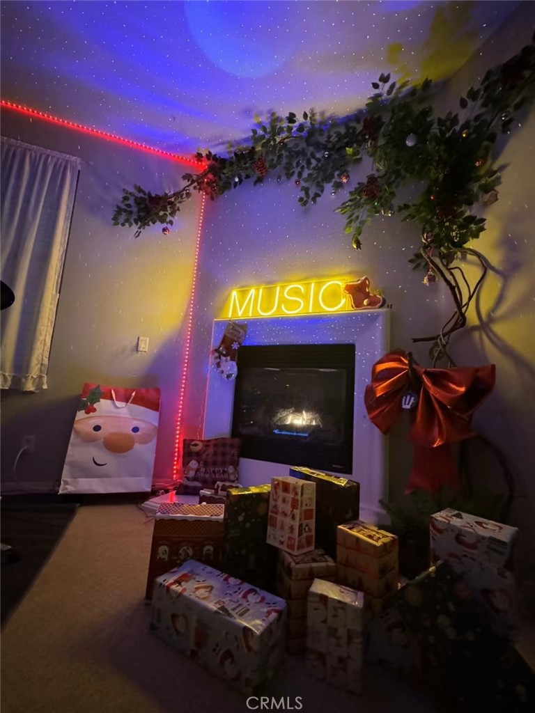 8541 Oak Barrel Place, Unit 2 Rancho Cucamonga, CA 91730 - Photo 50 of 50 a living room with furniture and a fireplace