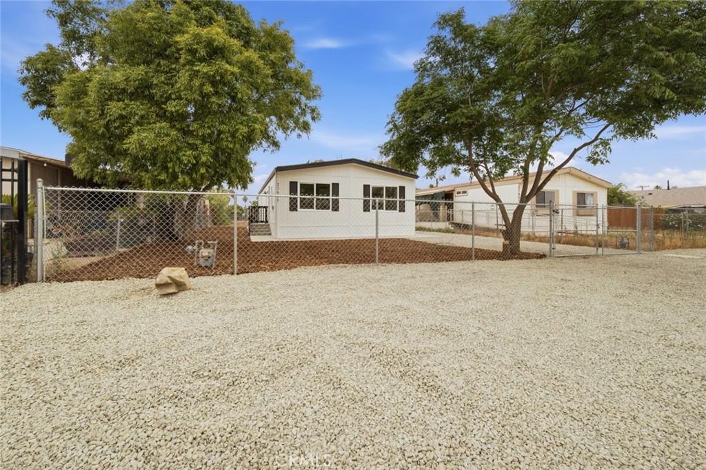 27615 Harrison Avenue Menifee, CA 92585 - Photo 2 of 18 a view of a house with a yard