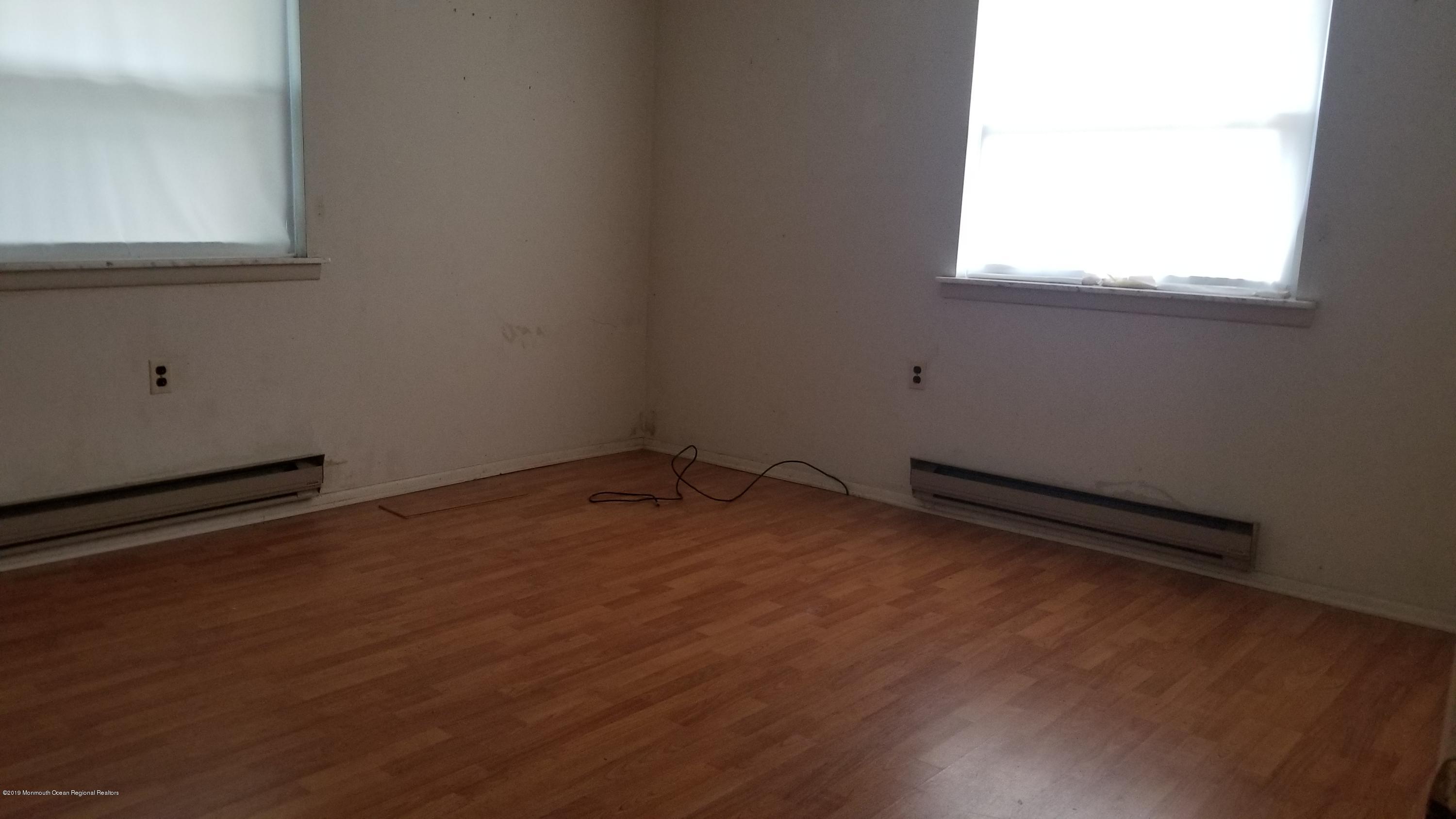 2 Conestoga Drive, Unit A Whiting, NJ 08759 - Photo 12 of 12 an empty room with a window