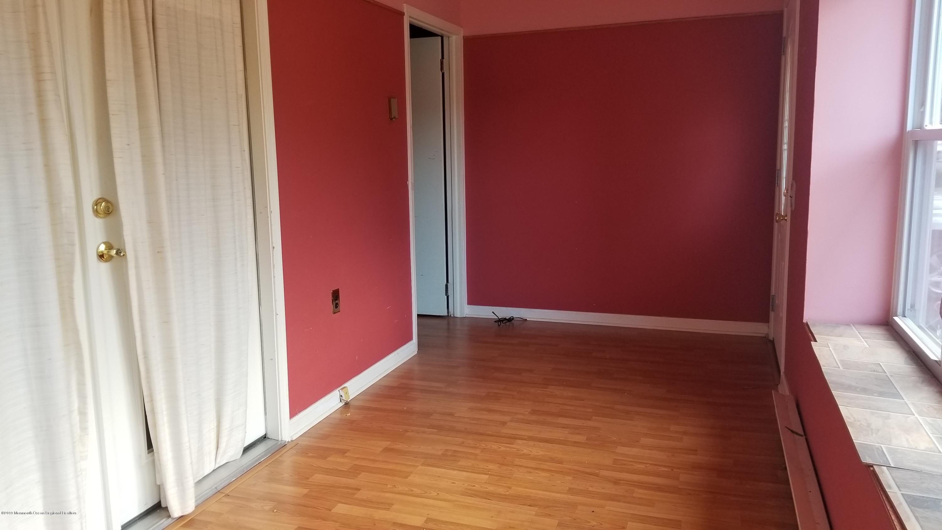 2 Conestoga Drive, Unit A Whiting, NJ 08759 - Photo 7 of 12 a view of an empty room and wooden floor