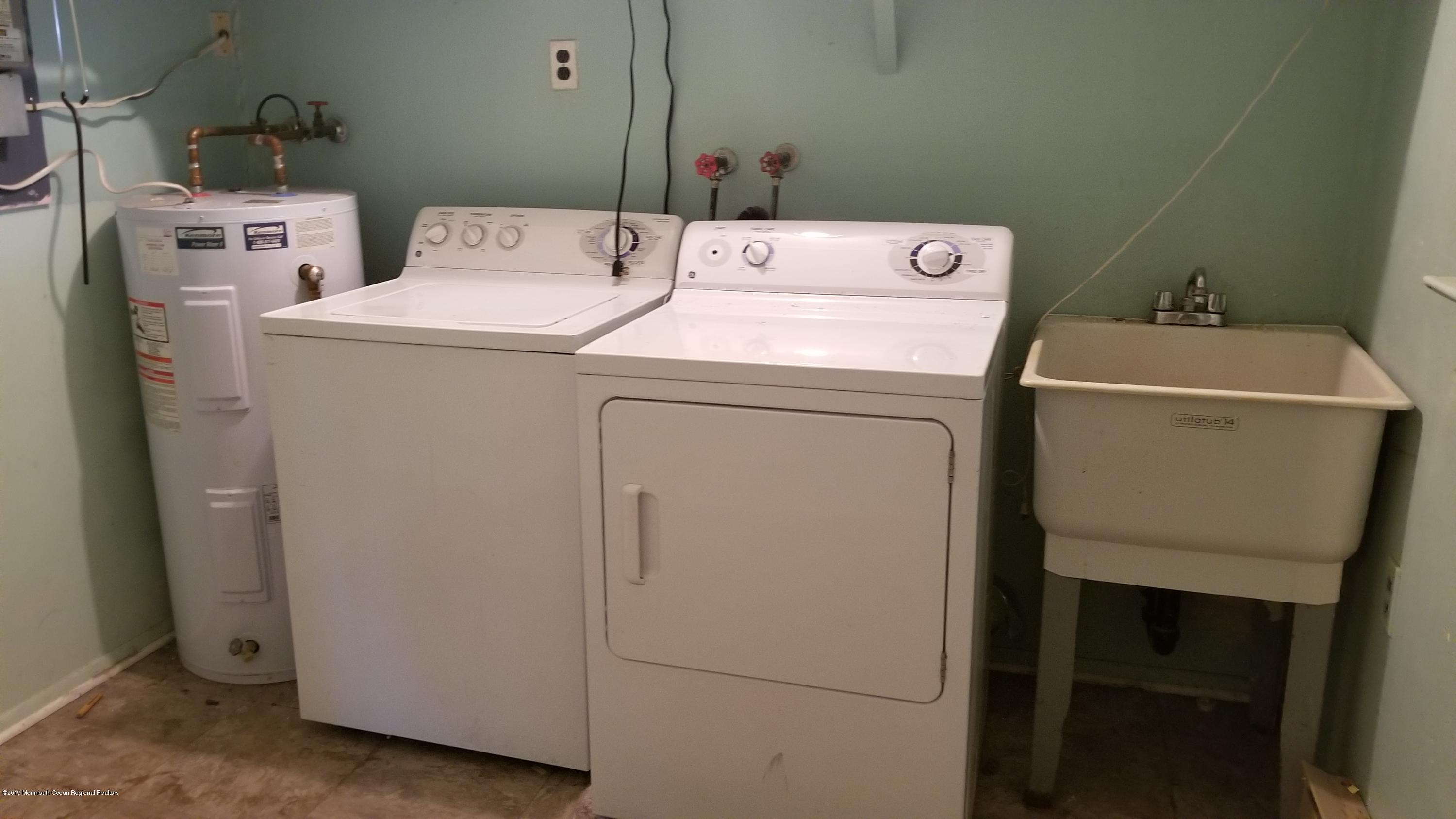2 Conestoga Drive, Unit A Whiting, NJ 08759 - Photo 9 of 12 a utility room with dryer and washer
