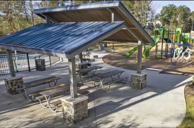 a view of swimming pool with outdoor seating