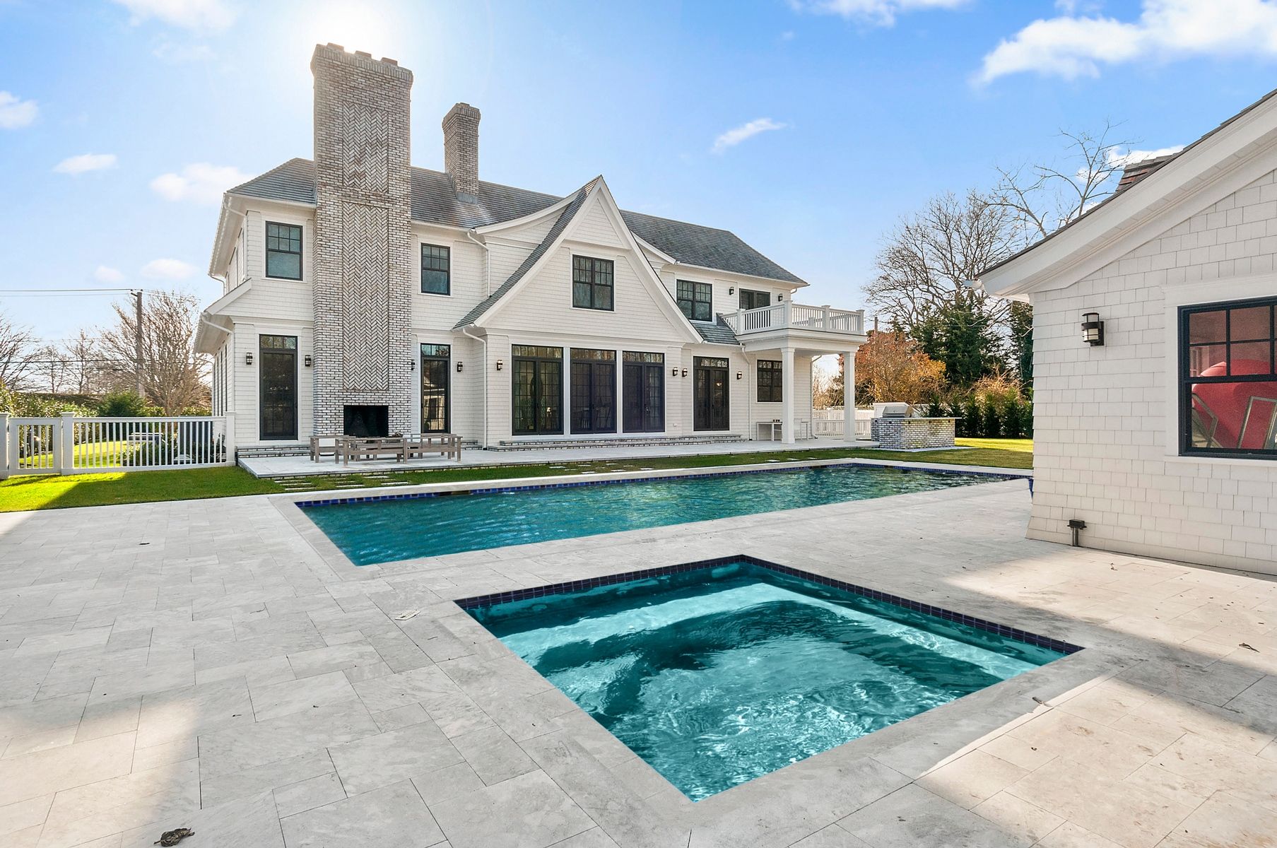 107 Wickapogue Road Southampton, NY 11968 - Photo 2 of 18 a view of swimming pool with a yard and plants