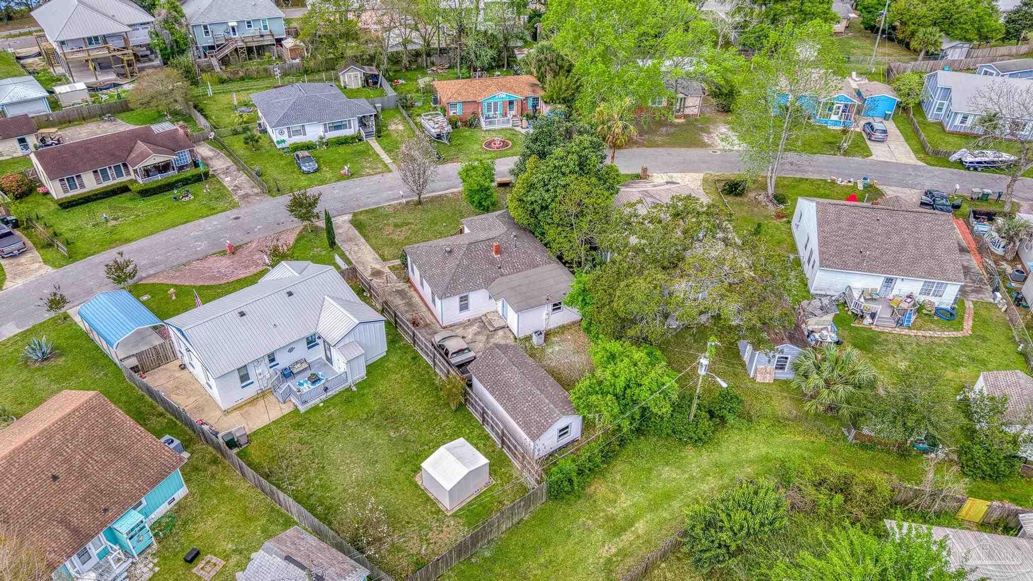 208 Berry Road Pensacola, FL 32507 - Photo 37 of 41 an aerial view of residential houses with outdoor space and parking