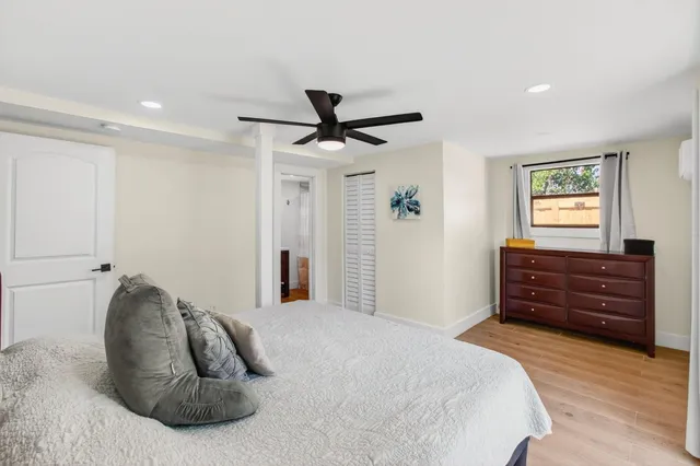 a bedroom with a bed and a dresser